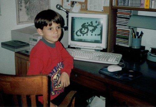 Photograph of a young Nick at the computer.