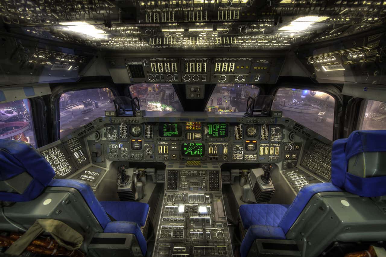 Photograph of the cockpit from a mockup space shuttle titled "Adventurer" located inside Space Center Houston, Texas.