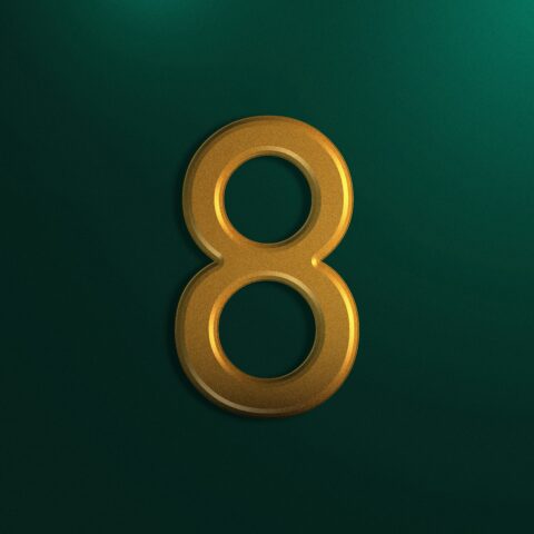 Gold number 8 atop green background representing 8 best no-code app builders
